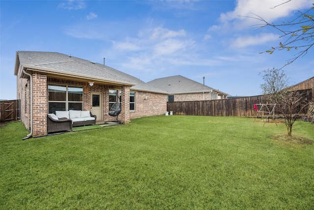 back of house featuring an outdoor hangout area and a lawn