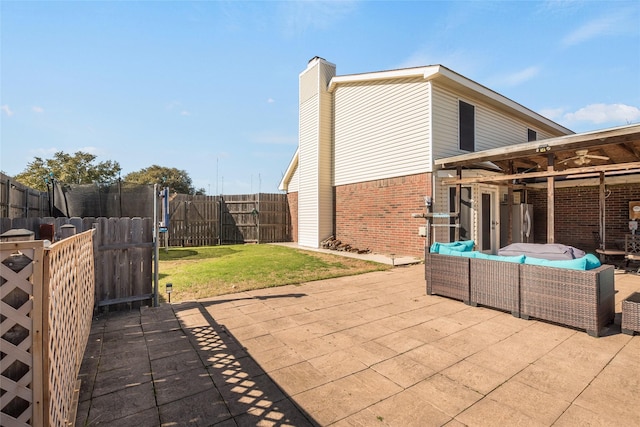 view of patio with an outdoor living space and a trampoline