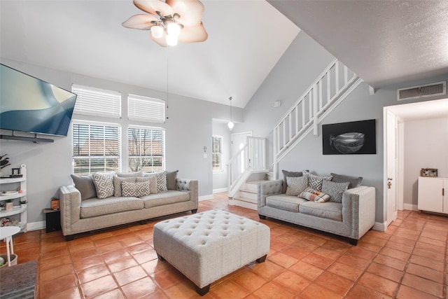 living room featuring high vaulted ceiling and ceiling fan