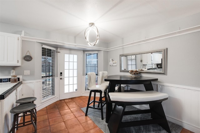 dining space with light tile patterned floors