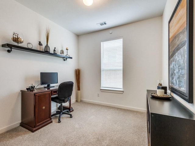 carpeted home office with a wealth of natural light