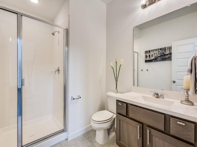 bathroom featuring vanity, a shower with shower door, tile patterned floors, and toilet