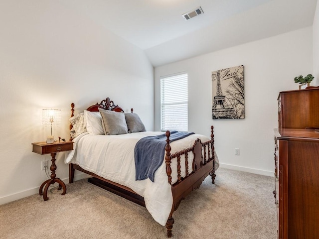 carpeted bedroom featuring lofted ceiling