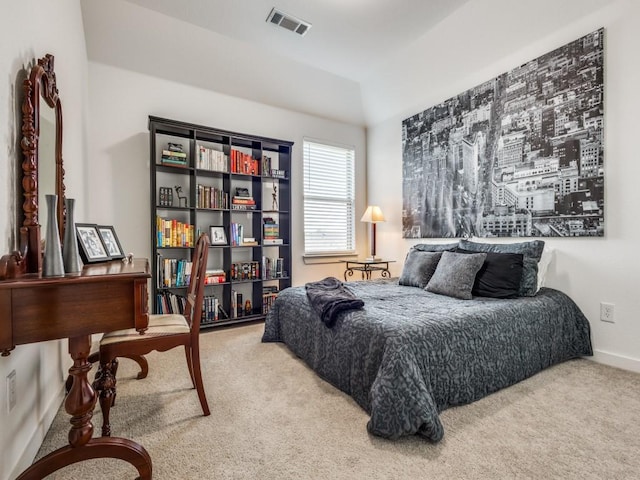 carpeted bedroom with vaulted ceiling