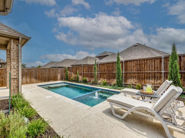 view of swimming pool with a patio and pool water feature