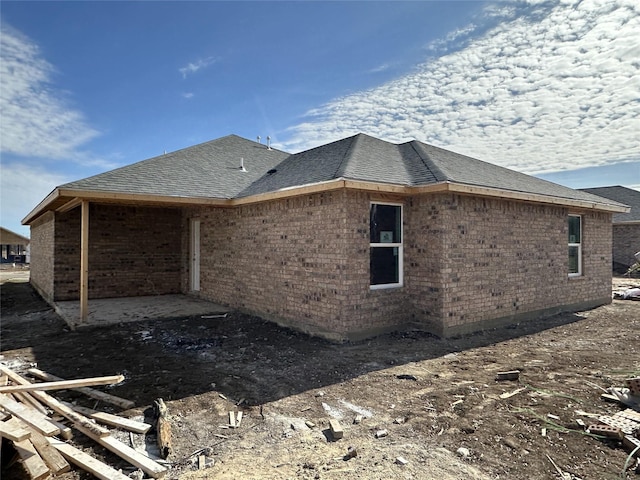 view of side of home with a patio