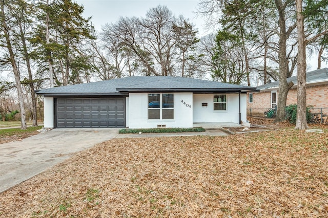 ranch-style home with a garage