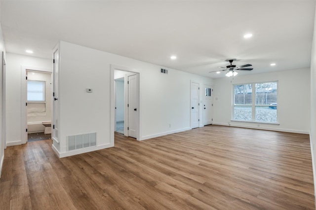 interior space with light hardwood / wood-style flooring and ceiling fan