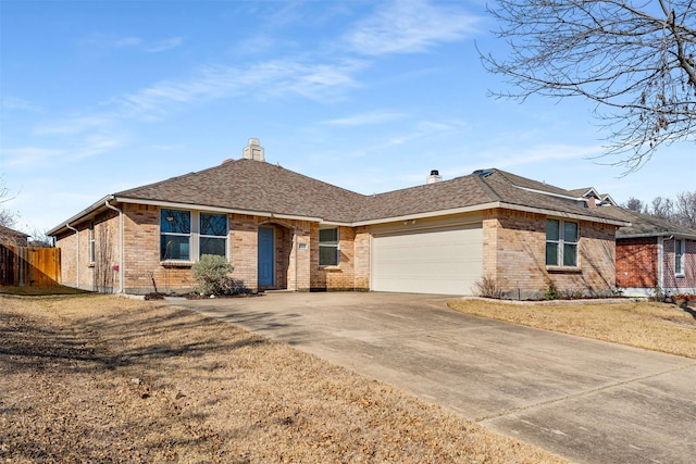 ranch-style home featuring a garage and a front lawn