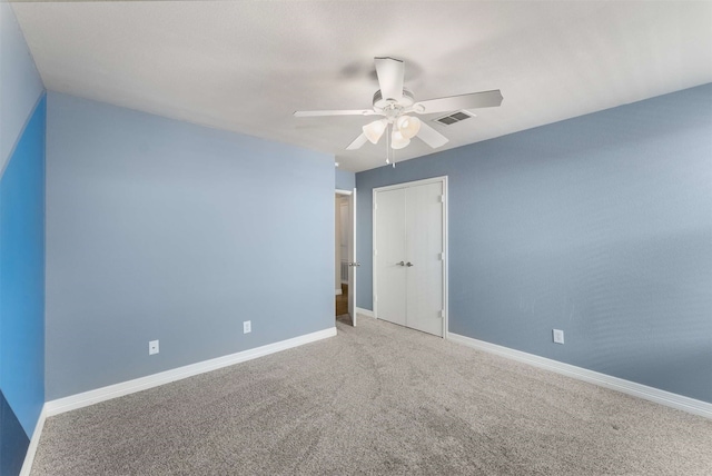 unfurnished room featuring carpet floors and ceiling fan