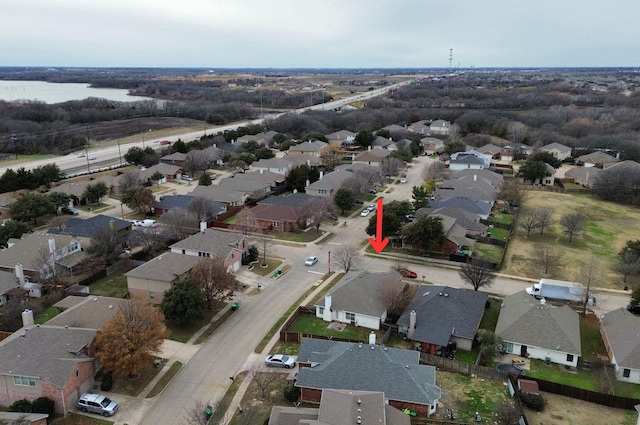 birds eye view of property featuring a residential view and a water view