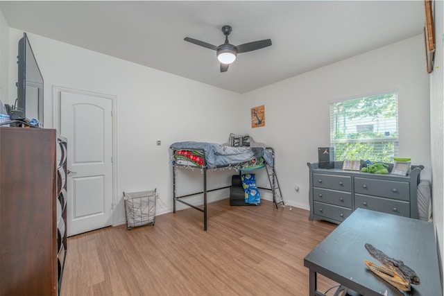 bedroom featuring ceiling fan and light hardwood / wood-style flooring