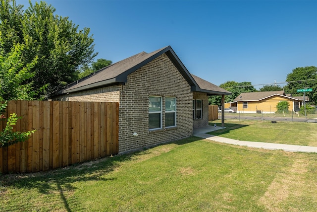 view of property exterior featuring a yard