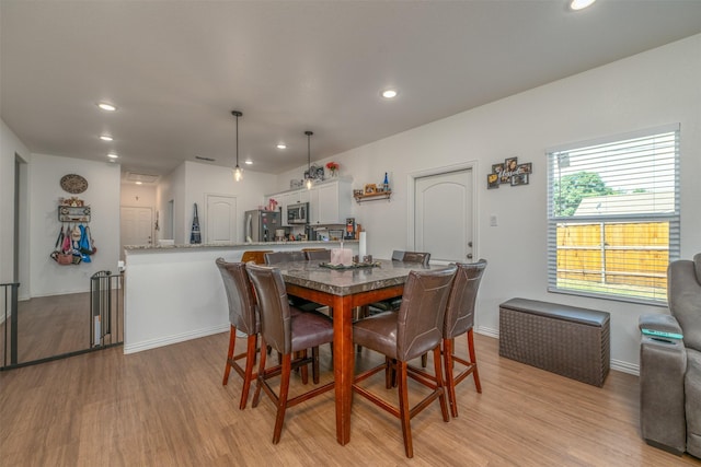 dining room featuring light hardwood / wood-style flooring