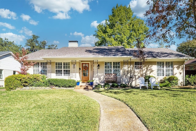 ranch-style home with a front lawn and a porch