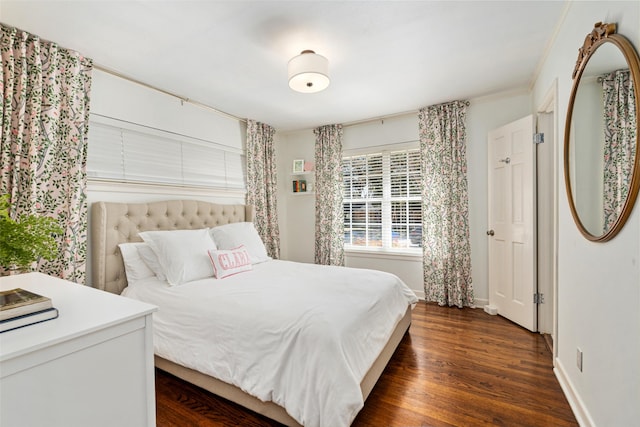 bedroom with dark wood-type flooring