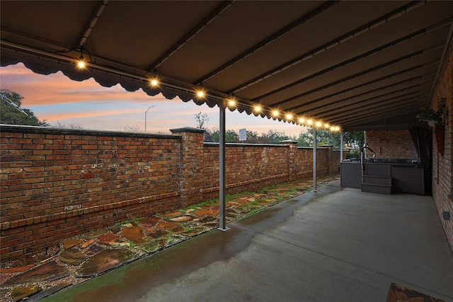 view of patio terrace at dusk