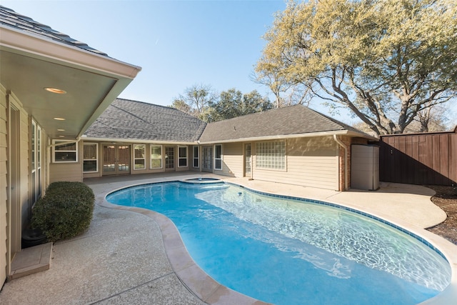 view of pool featuring an in ground hot tub and a patio area