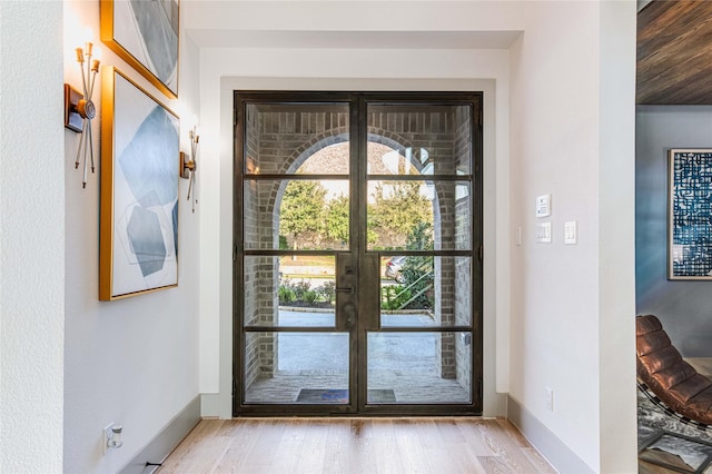 doorway with light hardwood / wood-style floors