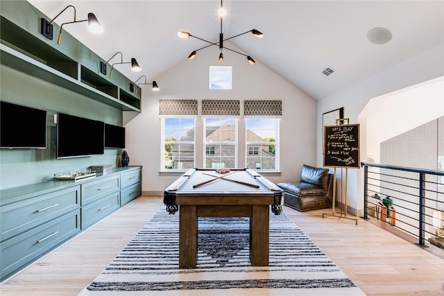 recreation room featuring billiards, vaulted ceiling, and light hardwood / wood-style flooring