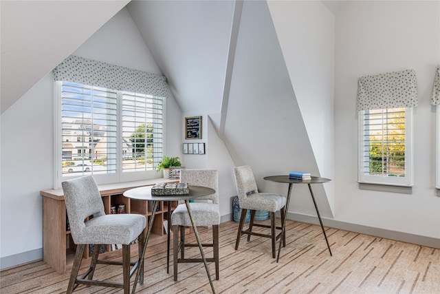 interior space featuring vaulted ceiling and light hardwood / wood-style floors