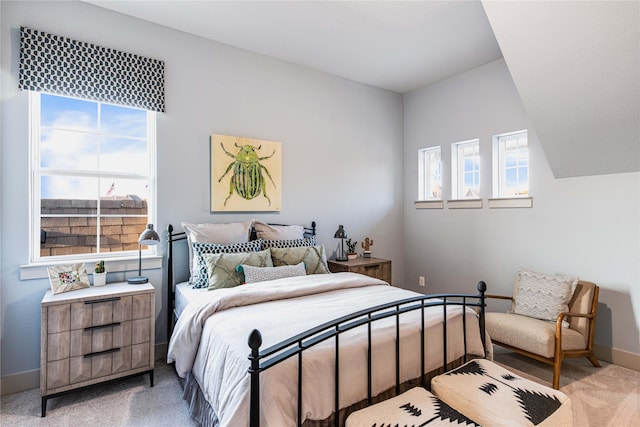 bedroom with light colored carpet