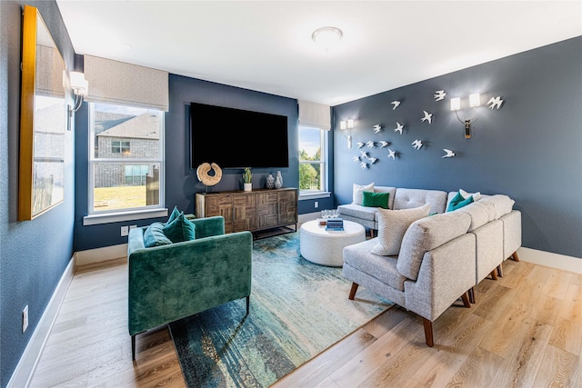 living room featuring wood finished floors and baseboards