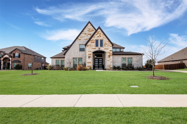 view of front of property with french doors and a front yard