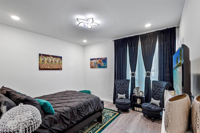 bedroom with wood-type flooring