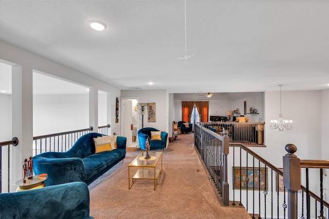 living room with light carpet and a notable chandelier