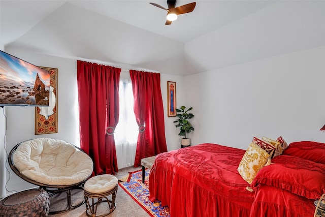 bedroom featuring ceiling fan, lofted ceiling, and carpet flooring