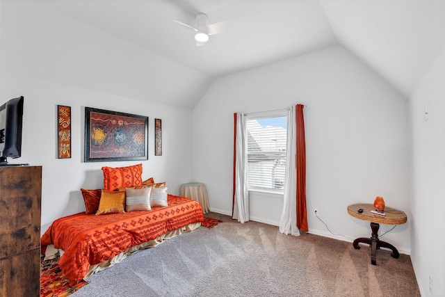 carpeted bedroom with ceiling fan and vaulted ceiling