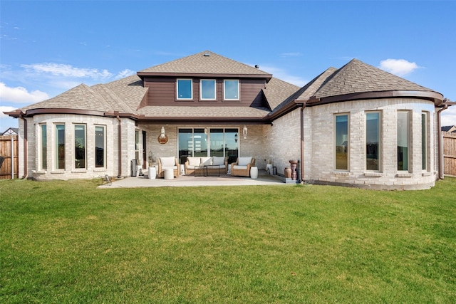 rear view of property featuring a patio, an outdoor hangout area, and a lawn