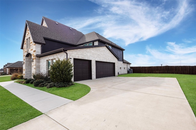 view of side of property with a lawn and central air condition unit