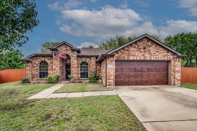 view of front facade featuring a garage and a front lawn