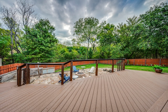 wooden deck featuring a fire pit