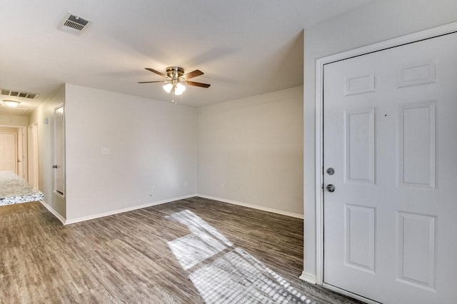 empty room featuring hardwood / wood-style floors and ceiling fan