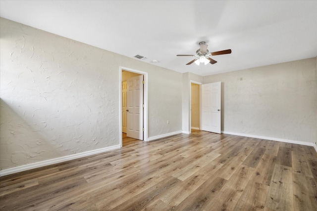 unfurnished bedroom with hardwood / wood-style floors and ceiling fan