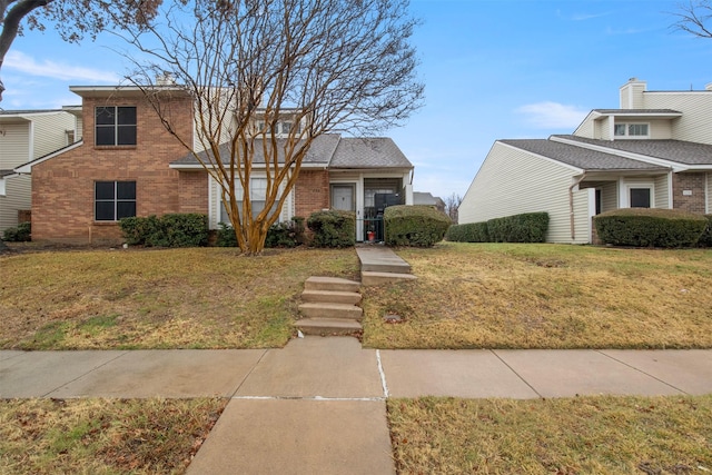 front facade featuring a front lawn