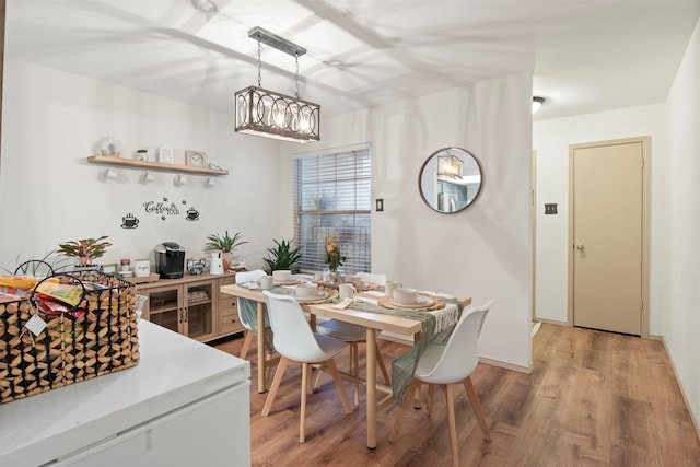 dining area with light wood-style floors