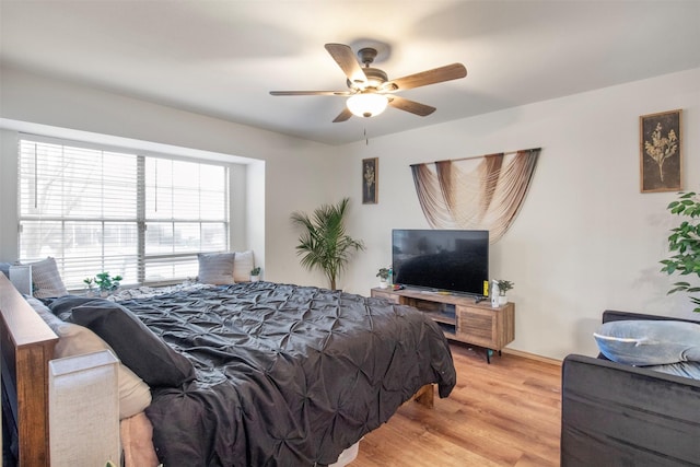 bedroom featuring ceiling fan and light wood-type flooring