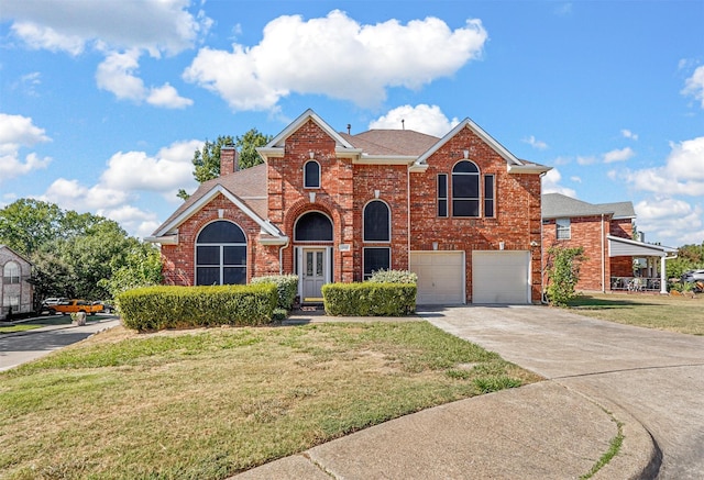 view of front property with a garage and a front yard