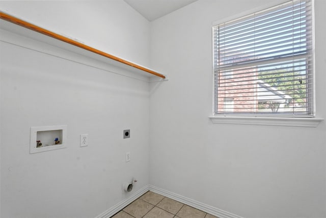 washroom featuring light tile patterned flooring, washer hookup, and electric dryer hookup