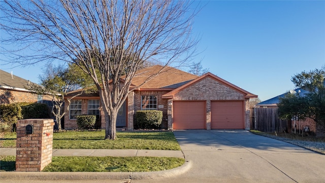 single story home with a garage and a front yard