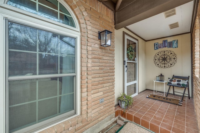 doorway to property with a porch