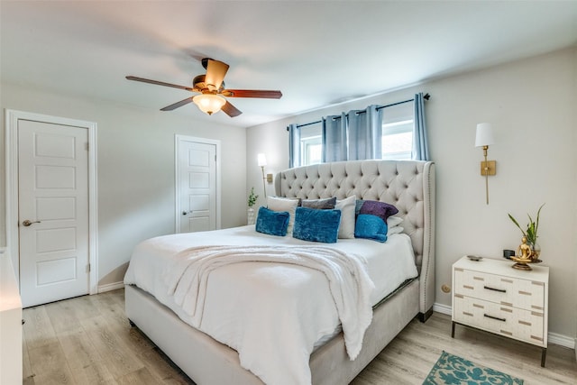 bedroom featuring ceiling fan and light hardwood / wood-style flooring