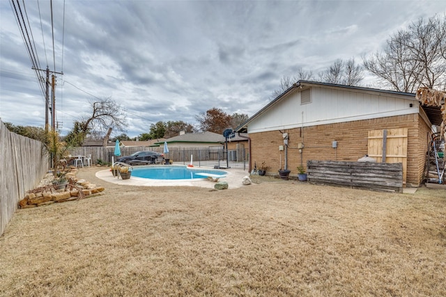 view of yard with a fenced in pool and a patio area