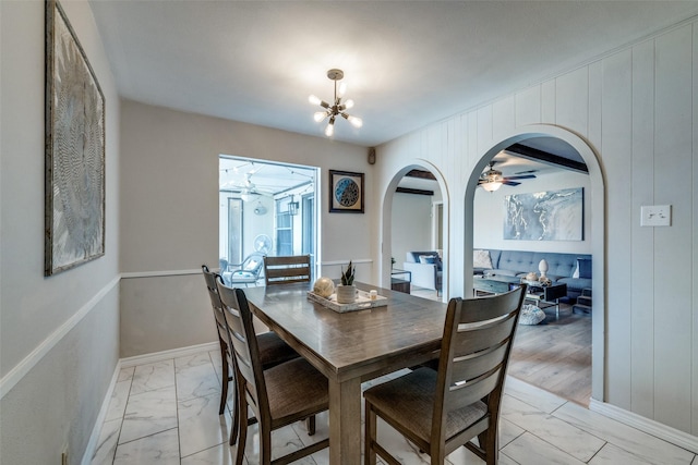 dining space with a notable chandelier