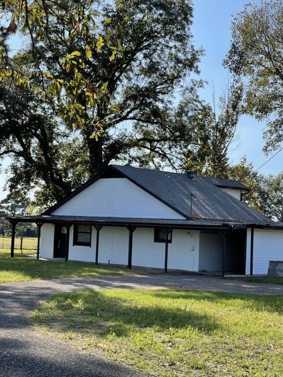 garage featuring a yard