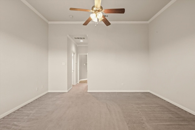 unfurnished room featuring crown molding, ceiling fan, and light carpet